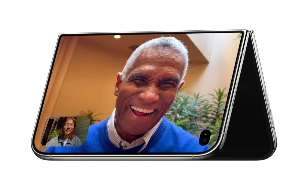iPhone Duo partially folded on a table during a FaceTime video call